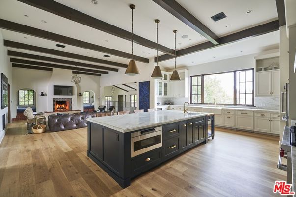Fireplace, Interior, Kitchen, Living room, Pendant Lights, Recessed Lighting, Stainless Steel Appliances, Wooden Beams, Wood Texture Flooring