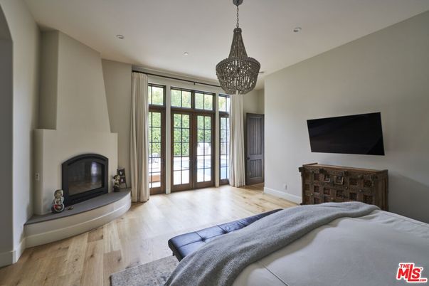 Bedroom, Fireplace, Interior, Pendant Lights, Recessed Lighting, Wood Texture Flooring