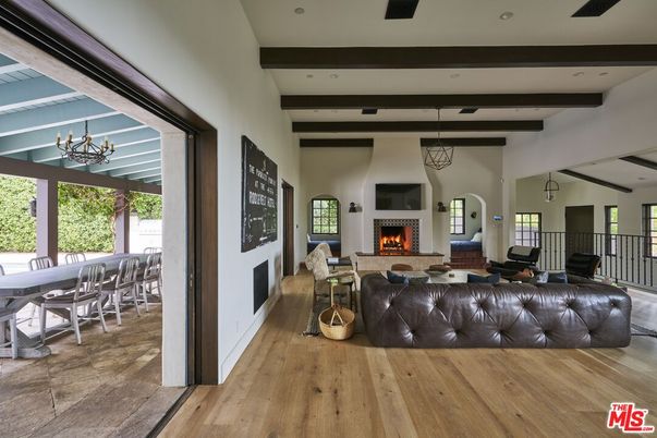 Chandelier, Dining room, Fireplace, Interior, Living room, Pendant Lights, Recessed Lighting, Wooden Beams, Wood Texture Flooring