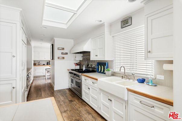 Interior, Kitchen, Recessed Lighting, Tile Countertops, Wood Texture Flooring