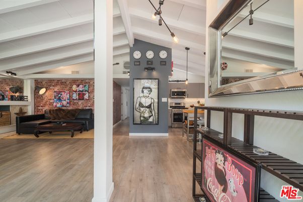 Fireplace, Interior, Kitchen, Pendant Lights, Stainless Steel Appliances, Stone Walls, Wood Texture Flooring