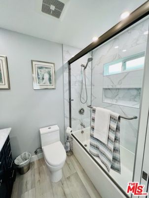 Bathroom, Glass Shower, Interior, Marble Walls, Recessed Lighting, Wood Texture Flooring