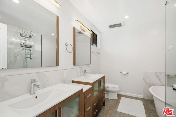 Bathroom, Dual Sink Vanities, Free Standing Baths, Interior, Recessed Lighting, Wood Texture Flooring