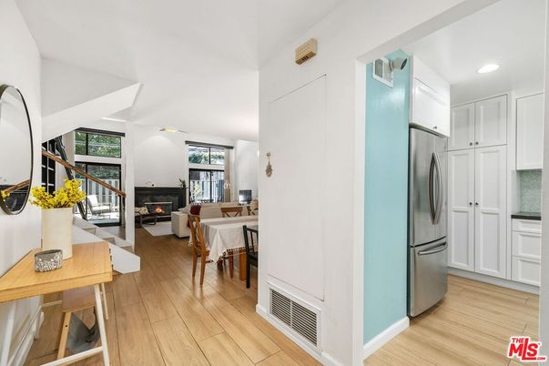 Dining room, Fireplace, Interior, Kitchen, Living room, Recessed Lighting, Stainless Steel Appliances, Wood Texture Flooring