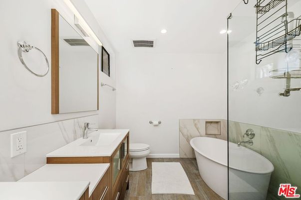 Bathroom, Dual Sink Vanities, Free Standing Baths, Interior, Recessed Lighting, Wood Texture Flooring