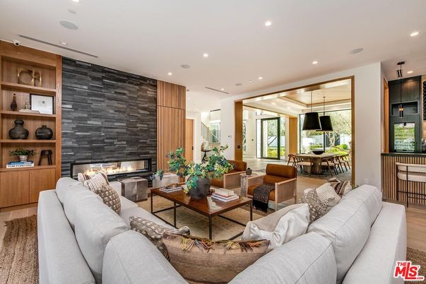Dining room, Fireplace, Interior, Living room, Pendant Lights, Recessed Lighting, Stone Walls, Wood Texture Flooring, Wooden Walls