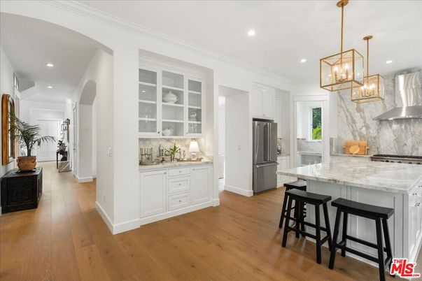 Interior, Kitchen, Marble Walls, Pendant Lights, Recessed Lighting, Stainless Steel Appliances, Wood Texture Flooring