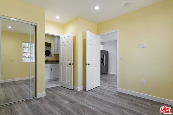 Empty room, Interior, Recessed Lighting, Utility Closets, Washer, Wood Texture Flooring