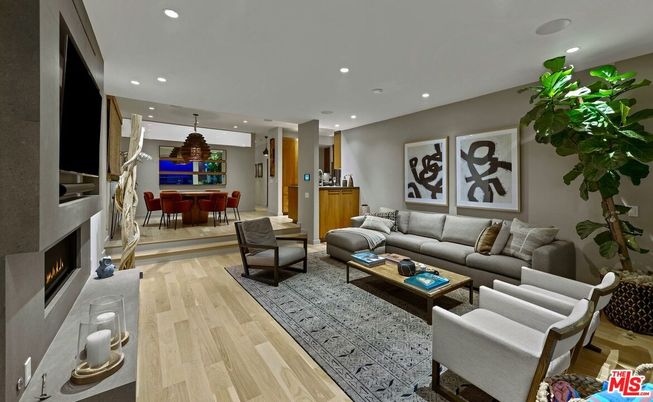 Dining room, Fireplace, Interior, Living room, Pendant Lights, Recessed Lighting, Wood Texture Flooring