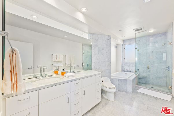 Bathroom, Dual Sink Vanities, Glass Shower, Interior, Marble, Marble Walls, Recessed Lighting