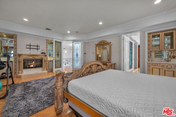 Bedroom, Fireplace, Interior, Recessed Lighting, Wood Texture Flooring
