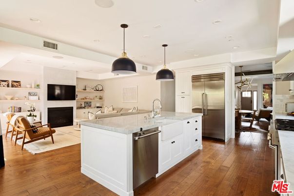 Dining room, Fireplace, Interior, Kitchen, Living room, Pendant Lights, Recessed Lighting, Stainless Steel Appliances, Wood Texture Flooring