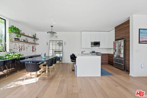 Chandelier, Dining room, Interior, Kitchen, Recessed Lighting, Stainless Steel Appliances, Wood Texture Flooring