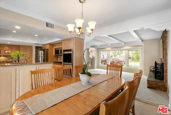 Chandelier, Dining room, Fireplace, Interior, Kitchen, Recessed Lighting, Stainless Steel Appliances