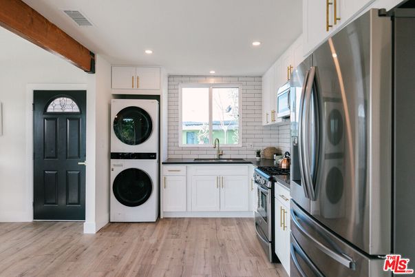Interior, Kitchen, Recessed Lighting, Stainless Steel Appliances, Washer, Wood Texture Flooring
