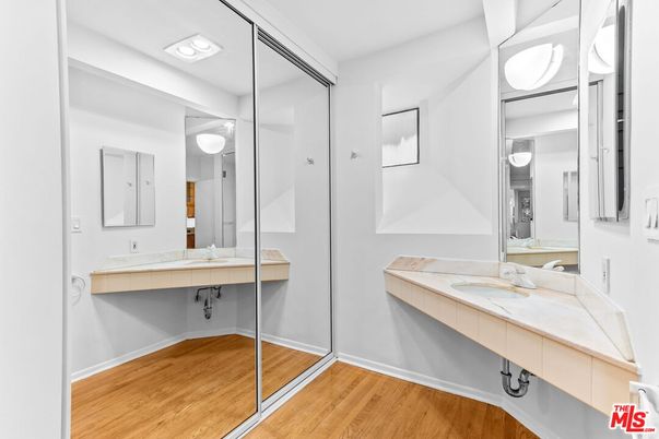 Bathroom, Dual Sink Vanities, Glass Shower, Interior, Recessed Lighting, Tile Countertops, Wood Texture Flooring