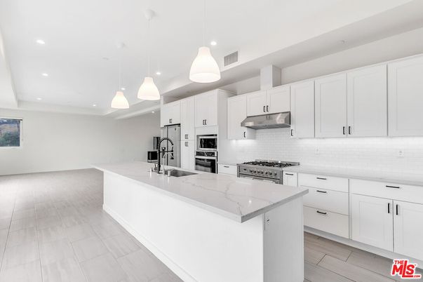 Interior, Kitchen, Pendant Lights, Recessed Lighting, Stainless Steel Appliances, Wood Texture Flooring