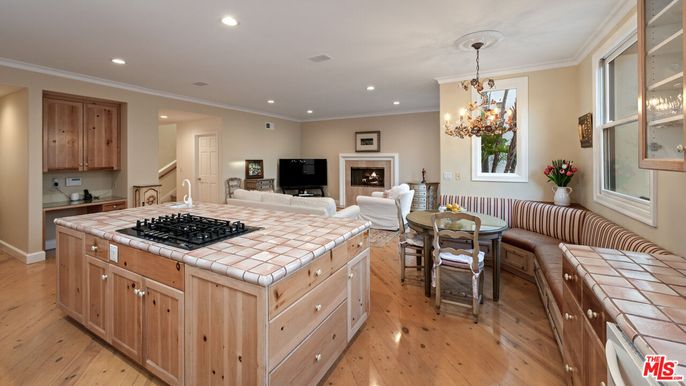 Chandelier, Dining room, Fireplace, Interior, Kitchen, Living room, Pendant Lights, Recessed Lighting, Tile Countertops, Wood Texture Flooring