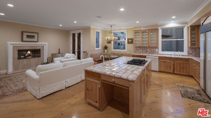 Chandelier, Dining room, Fireplace, Interior, Kitchen, Living room, Recessed Lighting, Tile Countertops, Wood Texture Flooring