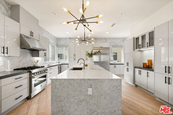 Interior, Kitchen, Marble Walls, Pendant Lights, Recessed Lighting, Stainless Steel Appliances, Wood Texture Flooring