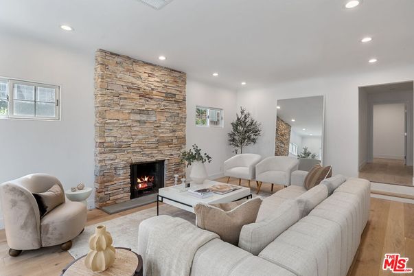 Fireplace, Interior, Living room, Recessed Lighting, Stone Walls, Wood Texture Flooring