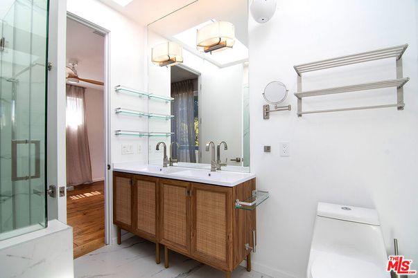 Bathroom, Dual Sink Vanities, Glass Shower, Interior, Marble, Wood Texture Flooring