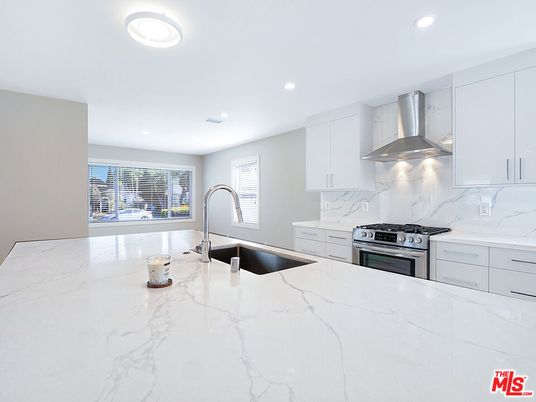 Interior, Kitchen, Marble Walls, Recessed Lighting, Stainless Steel Appliances