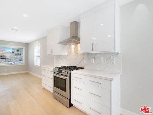 Interior, Kitchen, Marble Walls, Recessed Lighting, Stainless Steel Appliances, Wood Texture Flooring