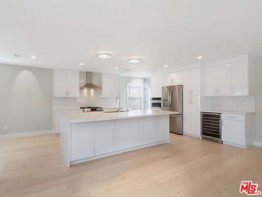 Interior, Kitchen, Marble Walls, Recessed Lighting, Stainless Steel Appliances, Wood Texture Flooring
