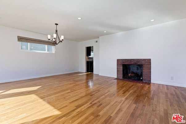 Chandelier, Empty room, Fireplace, Interior, Recessed Lighting, Wood Texture Flooring
