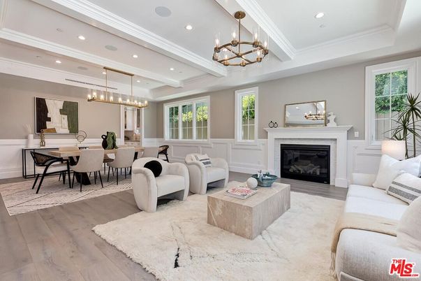 Chandelier, Dining room, Fireplace, Interior, Living room, Pendant Lights, Recessed Lighting, Wood Texture Flooring