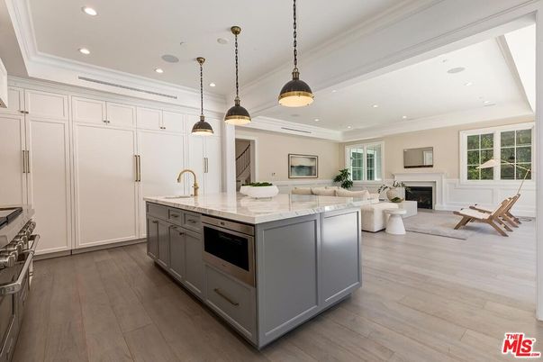 Fireplace, Interior, Kitchen, Living room, Pendant Lights, Recessed Lighting, Stainless Steel Appliances, Wood Texture Flooring