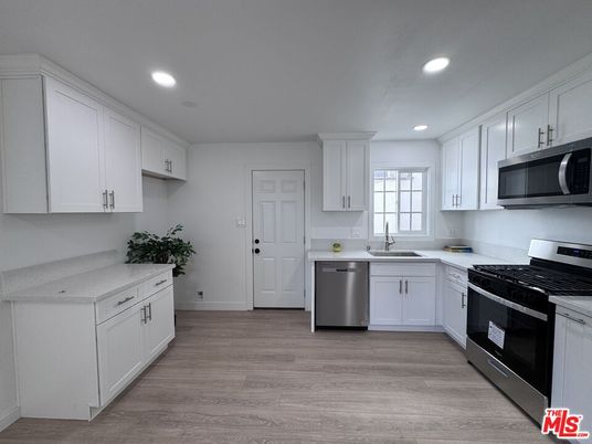 Interior, Kitchen, Recessed Lighting, Stainless Steel Appliances, Wood Texture Flooring