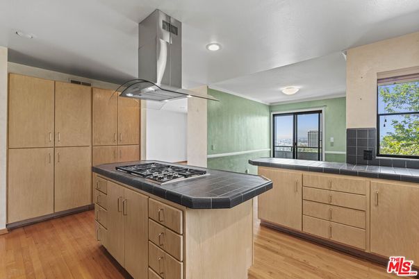 Interior, Kitchen, Recessed Lighting, Tile Countertops, Wood Texture Flooring