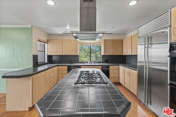 Interior, Kitchen, Recessed Lighting, Stainless Steel Appliances, Tile Countertops, Wood Texture Flooring
