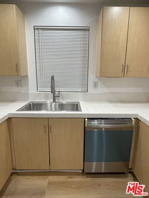 Interior, Kitchen, Stainless Steel Appliances, Tile Countertops, Wood Texture Flooring