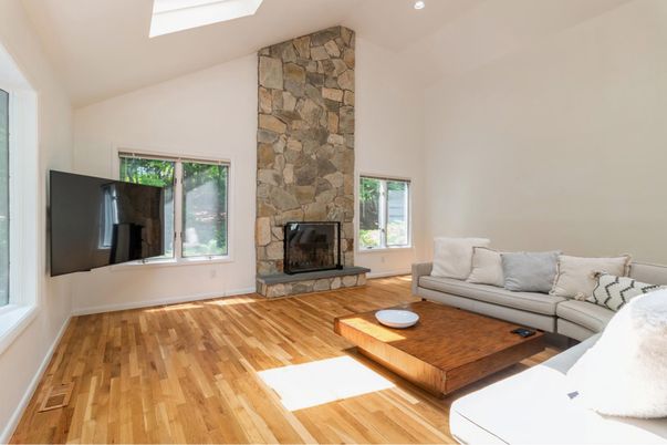 Fireplace, Interior, Living room, Recessed Lighting, Stone Walls, Wood Texture Flooring