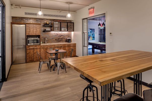 Dining room, Interior, Kitchen, Pendant Lights, Stainless Steel Appliances, Stone Walls, Wood Texture Flooring