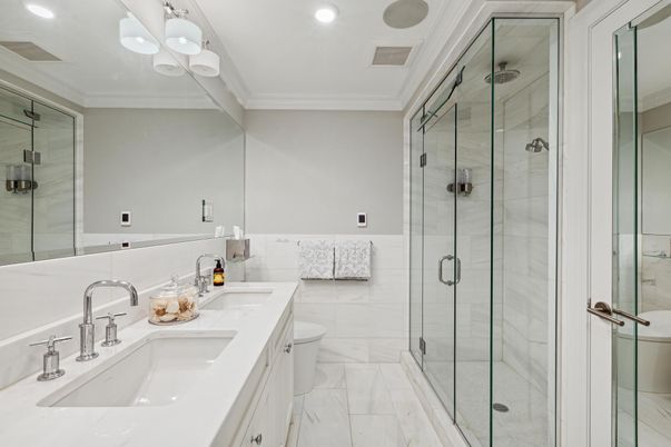 Bathroom, Dual Sink Vanities, Glass Shower, Interior, Marble, Marble Walls, Recessed Lighting