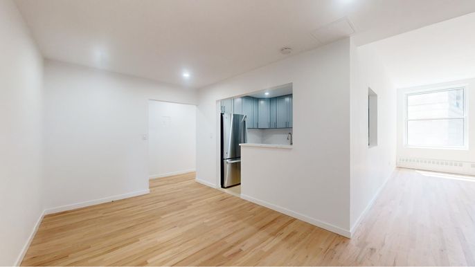 Empty room, Interior, Kitchen, Recessed Lighting, Stainless Steel Appliances, Wood Texture Flooring