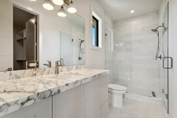 Bathroom, Dual Sink Vanities, Glass Shower, Interior, Marble Walls, Recessed Lighting