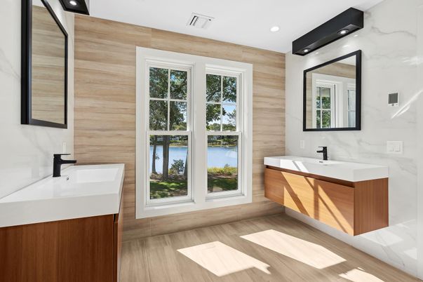 Bathroom, Dual Sink Vanities, Interior, Marble Walls, Recessed Lighting, Wood Texture Flooring
