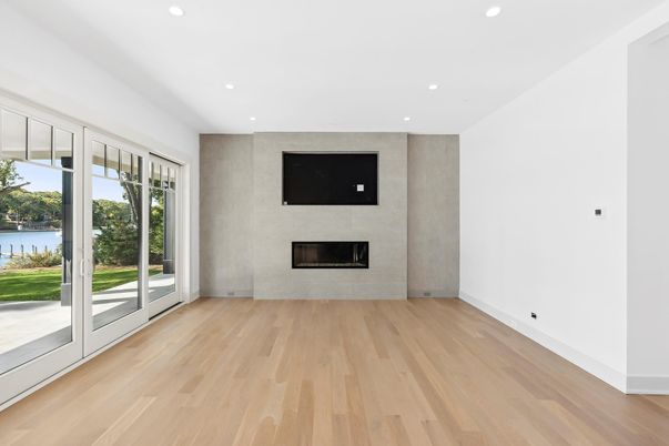 Empty room, Fireplace, Interior, Recessed Lighting, Water, Wood Texture Flooring