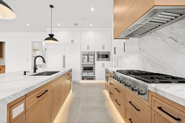 Interior, Kitchen, Marble Walls, Pendant Lights, Recessed Lighting, Stainless Steel Appliances