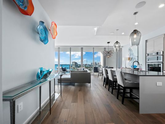 Chandelier, Dining room, Interior, Kitchen, Living room, Pendant Lights, Recessed Lighting, Stainless Steel Appliances, Wood Texture Flooring