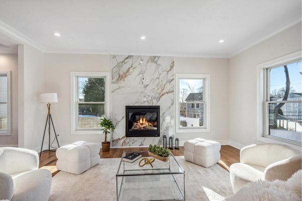 Fireplace, Interior, Living room, Marble Walls, Recessed Lighting, Wood Texture Flooring