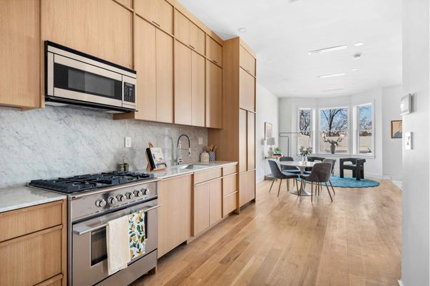Dining room, Interior, Kitchen, Marble Walls, Recessed Lighting, Stainless Steel Appliances, Wood Texture Flooring