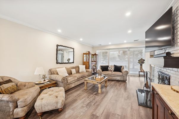 Fireplace, Interior, Living room, Recessed Lighting, Stone Walls, Wood Texture Flooring