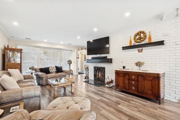 Fireplace, Interior, Living room, Recessed Lighting, Stone Walls, Wood Texture Flooring