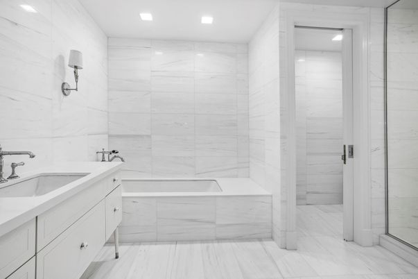 Bathroom, Dual Sink Vanities, Glass Shower, Interior, Marble, Marble Walls, Recessed Lighting